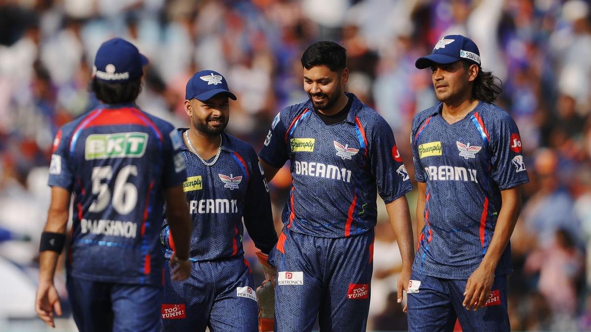Avesh Khan celebrates with teammates after taking the wicket of Shubman Gill.